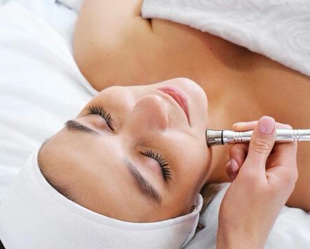 Client receiving facial treatment